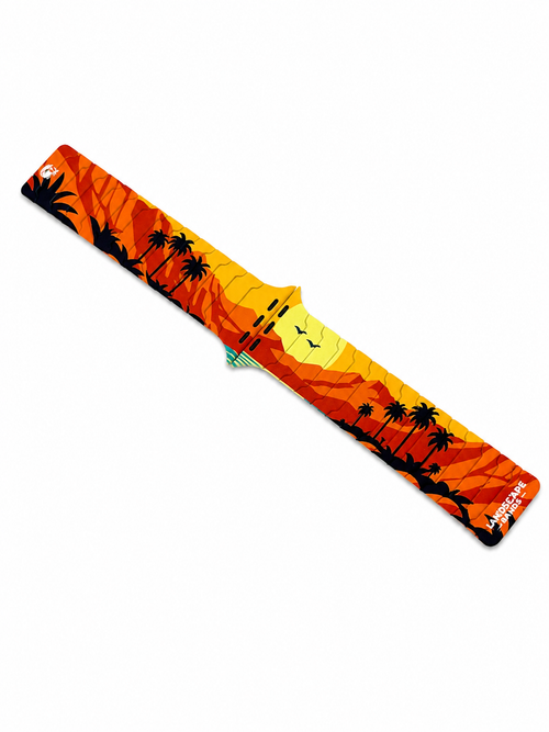 Angled view of the Sunset Oasis silicone magnetic Apple Watch band with vibrant desert sunset landscape artwork.