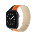 Magnetic Apple Watch with the Tropic Dusk silicone band featuring a colorful sunset landscape design.